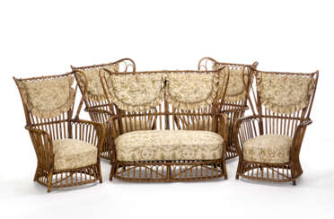 Living room furniture consisting of a sofa and four armchairs in manao, rush, rattan and bark; seat and back with padded cushions covered in flower fabric. Italy, 1950s. (divano cm 145x114x80; poltrone cm 85x114x80) (defects)