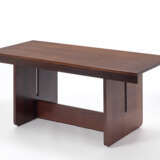 Table in veneered wood with legs joined by a crossbar. Italy, 1970s. (180x76x80.5 cm.) (slight defects) - photo 1