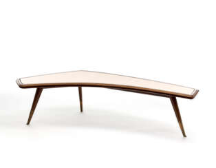 Tripod coffee table in solid wood with boomerang top covered in rosambé glass, brass feet. Italy, 1940s. (165x41 cm.) (slight defects)