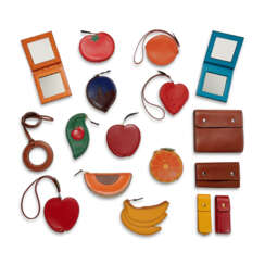 A SET OF SEVENTEEN: TEN FRUIT COIN PURSES, TWO TRAVEL MIRRORS, A SEWING KIT, TWO LIPSTICK HOLDERS, A KEY HOLDER & A MAGNIFYING CLASS NECKLACE
