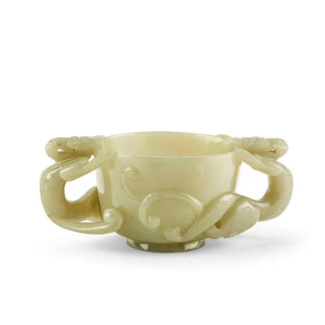 A JADE CELADON 'CHILONG' TWIN-HANDLED CUP - photo 1
