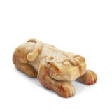 A BEIGE AND RUSSET JADE CARVING OF A BEAST - photo 1