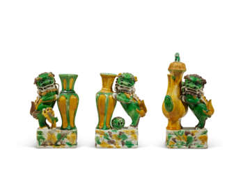 TWO FAMILLE VERTE BISCUIT 'BUDDHIST LION' VASES AND A FAMILLE VERTE 'BUDDHIST LION' EWER AND COVER