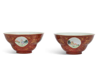 A PAIR OF CORAL-GROUND FAMILLE ROSE 'EUROPEAN SUBJECT' OGEE MEDALLION BOWLS