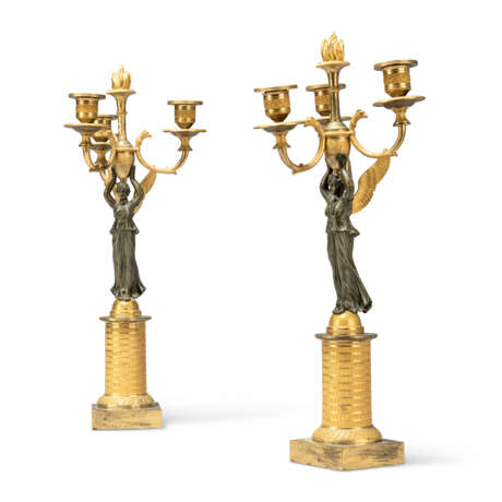 A PAIR OF EMPIRE ORMOLU AND PATINATED-BRONZE THREE-BRANCH CANDELABRA - photo 1