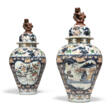 A PAIR OF CONTINENTAL FAIENCE IMARI BALUSTER VASES AND COVERS - Auction prices