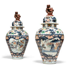 A PAIR OF CONTINENTAL FAIENCE IMARI BALUSTER VASES AND COVERS