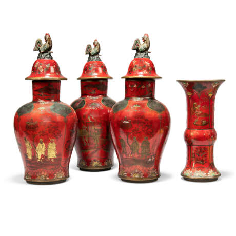 A GARNITURE OF THREE CONTINENTAL RED, BLACK AND PARCEL GILT JAPANNED FAYENCE BALUSTER VASES AND COVERS AND A FLARED BEAKER VASE - photo 2