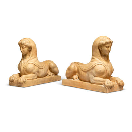 A PAIR OF TERRACOTTA RECUMBENT SPHINXES - фото 4