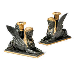 A PAIR OF REGENCY EBONISED AND PARCEL-GILT WOOD AND COMPOSITION MODELS OF SPHINXES 