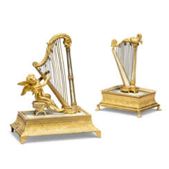 TWO RESTAURATION PALAIS ROYAL ORMOLU AND MOTHER-OF PEARL MUSICAL ORNAMENTS OR RING-STANDS MODELLED AS HARPS 