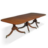 A MAHOGANY TRIPLE PEDESTAL DINING-TABLE - photo 1