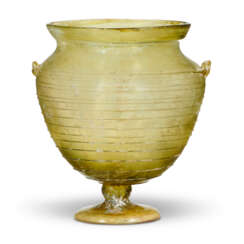 A ROMAN GREEN GLASS FOOTED KANTHAROS