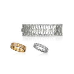 TWO CARTIER DIAMOND RINGS; TOGETHER WITH A DIAMOND BANGLE