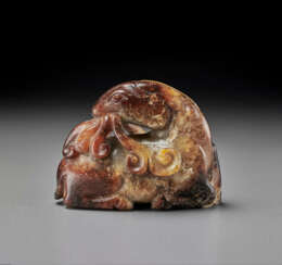 A MOTTLED RUSSET AND GREY JADE FIGURE OF A RAM