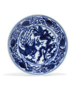 Longqing period. A RARE BLUE AND WHITE &#39;DRAGON AND PHOENIX’ DISH