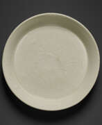 Ding ware. A SMALL CARVED DING CARVED DISH