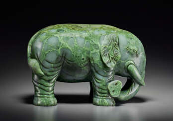 A SUPERB LARGE SPINACH-GREEN JADE FIGURE OF AN ELEPHANT