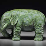A SUPERB LARGE SPINACH-GREEN JADE FIGURE OF AN ELEPHANT - photo 2