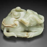A WELL-CARVED GREENISH-WHITE JADE `BUFFALO AND BOY’ GROUP - photo 2