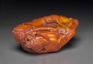 A SMALL CARVED AMBER MAGNOLIA-FORM WATER POT