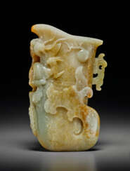 A PALE GREY AND RUSSET JADE RHYTON, GONG