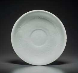 AN UNUSUAL CARVED DING-STYLE WHITE-GLAZED BOWL
