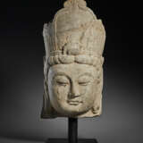 A FINELY CARVED LIMESTONE HEAD OF A BODHISATTVA - photo 1