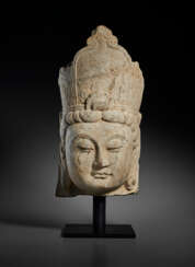 A FINELY CARVED LIMESTONE HEAD OF A BODHISATTVA