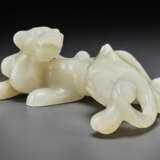 A PALE BEIGEISH-WHITE JADE FIGURE OF A STRIDING CHILONG - photo 2