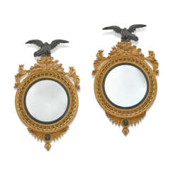A PAIR OF REGENCY GILTWOOD AND EBONISED CONVEX MIRRORS