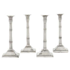 A SET OF FOUR GEORGE III SILVER CANDLESTICKS