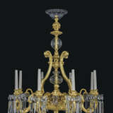 A FRENCH ORMOLU AND CUT-CRYSTAL GLASS TWELVE-LIGHT CHANDELIER - photo 1