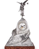 A LARGE SILVER MANTLE CLOCK