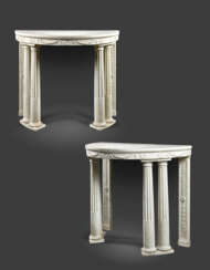 A PAIR OF EMPIRE WHITE-MARBLE DEMI-LUNE CONSOLE TABLES