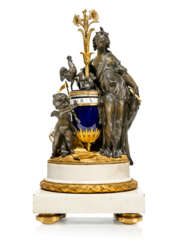 A LOUIS XVI ORMOLU-MOUNTED WHITE MARBLE, PATINATED-BRONZE AND SEVRES BLUE PORCELAIN PENDULE A CERCLES TOURNANTS