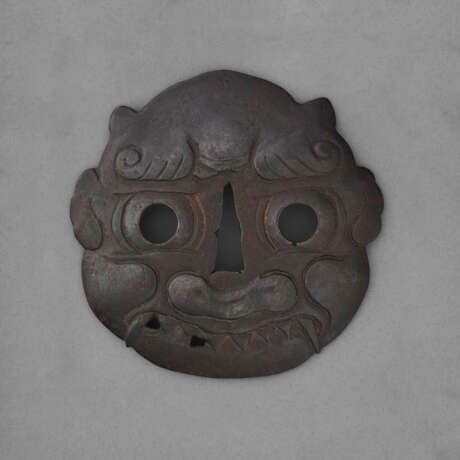 A LARGE IRON TSUBA IN THE FORM OF AN ONI MASK - фото 1