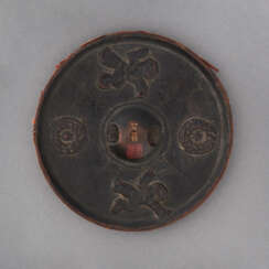 A ROUND LACQUER MODEL OF AN ANCIENT MIRROR