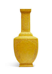 A YELLOW-ENAMELLED MOLDED AND INCISED `DRAGON’ FACETED BOTTLE VASE