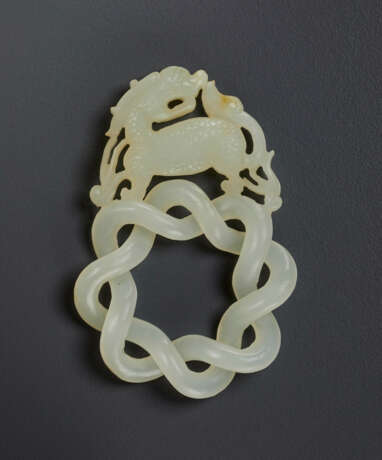 A WHITE JADE ENDLESS KNOT PENDANT - photo 1