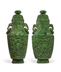 TWO CARVED SPINACH-GREEN JADE VASES AND COVERS