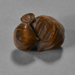 A CARVED WOOD SCULPTURE (NETSUKE) OF CHESTNUTS