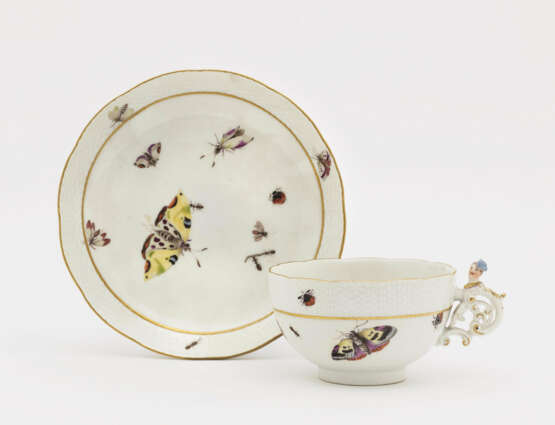 A cup with saucer - photo 1