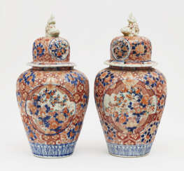A pair of lidded vases