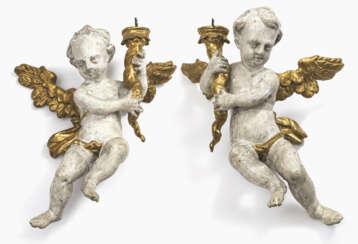 A pair of angels with candlesticks
