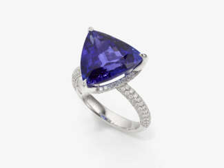 A ring with a tanzanite and brilliant cut diamonds