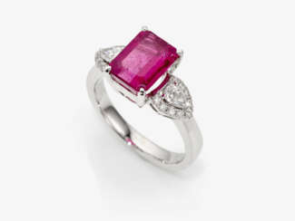 An eternity ring with a rubellite, brilliant cut diamonds and diamond drops