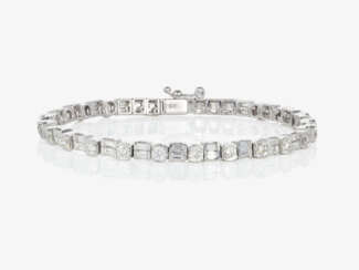 A Rivière bracelet decorated with brilliant- and baguette-cut diamonds