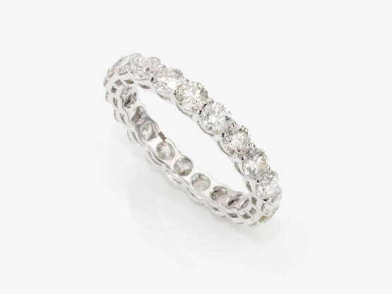 A memory ring decorated with brilliant cut diamonds - photo 1