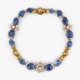 A parure consisting of: bracelet, pair of ear clips, ring with brilliant cut diamonds and sapphire cabochons - фото 3
